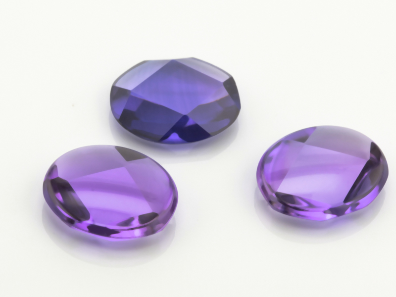 Synthetic/Lab Grown Sapphire 12x10mm Oval Buff Top Faceted Back German Cut Purple