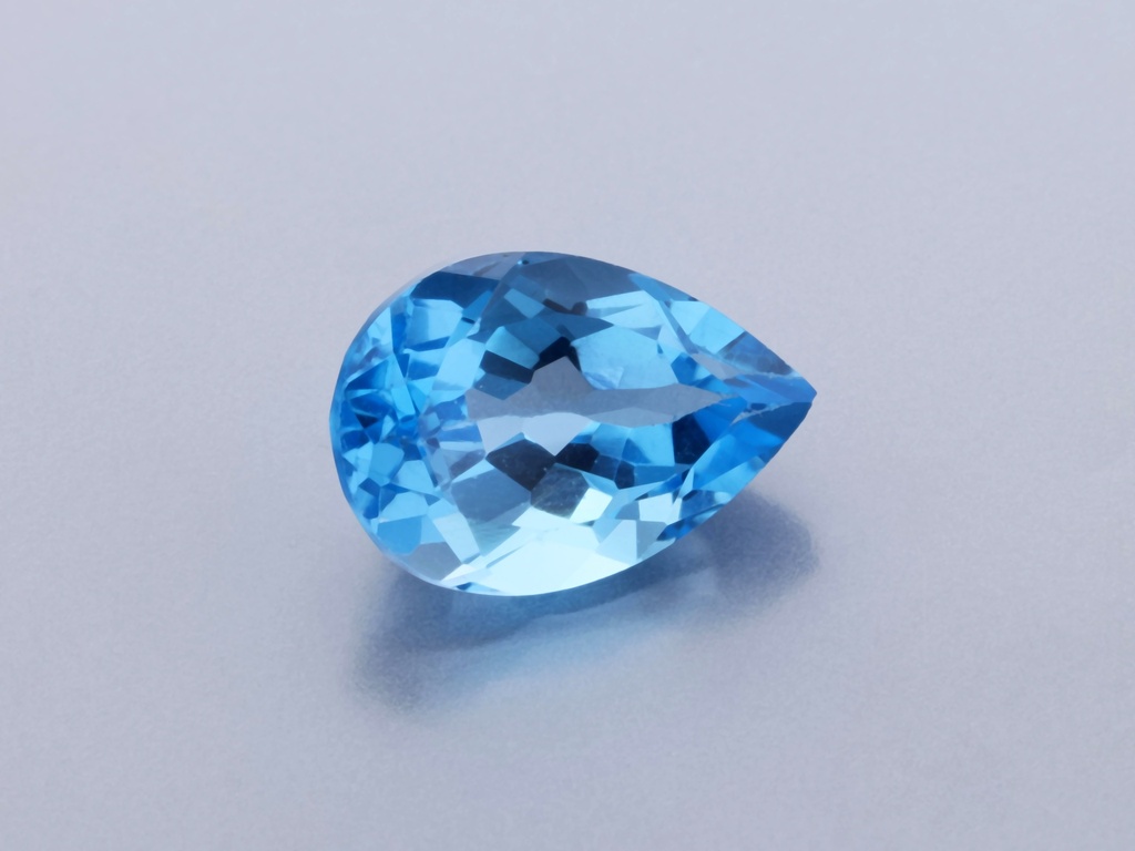 Topaz 10x7mm Pear Shape Medium Blue 
