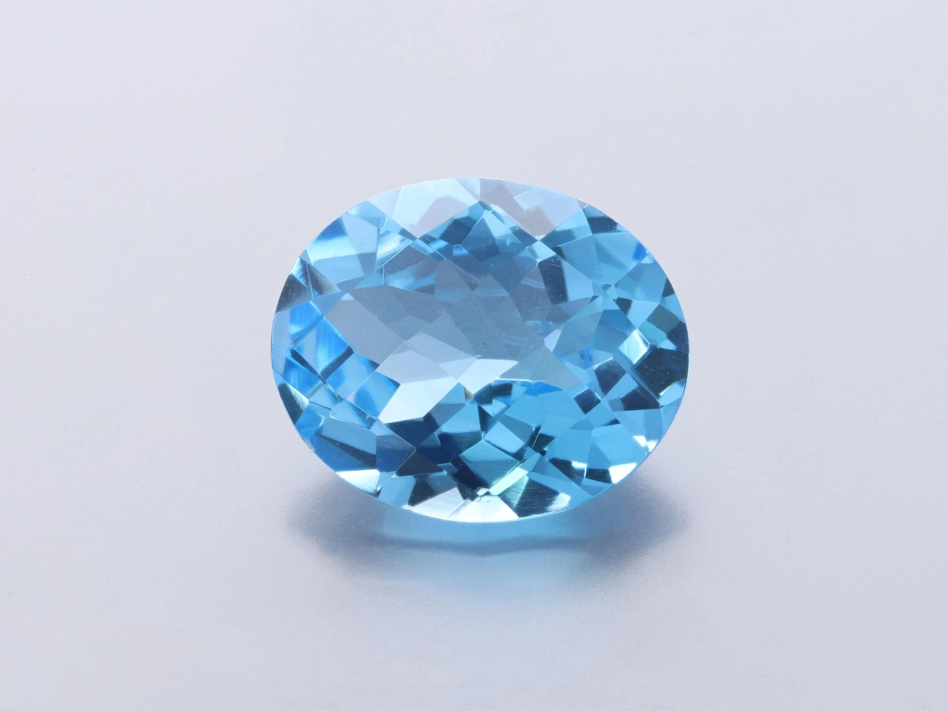 Topaz  12x10mm Oval Chequerboard Medium Blue 