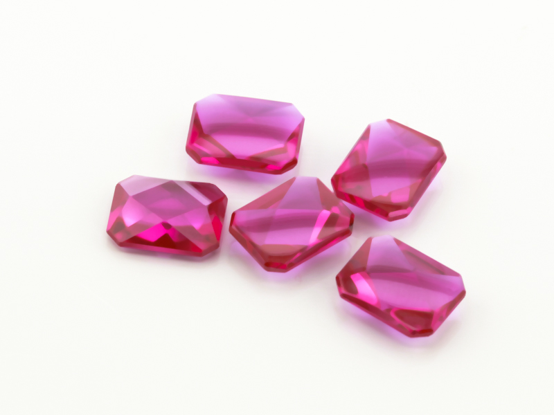 Synthetic/Lab Grown Ruby 9x7mm Emerald Cut Buff Top Faceted Back Bright Red