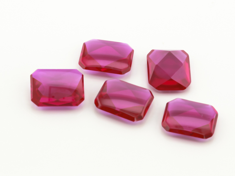 Synthetic/Lab Grown Ruby 10x8mm Emerald Cut Buff Top Faceted Back Bright Red