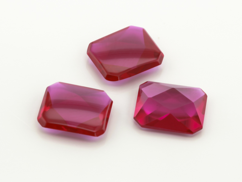 Synthetic/Lab Grown Ruby 12x10mm Emerald Cut Buff Top Faceted Back Bright Red