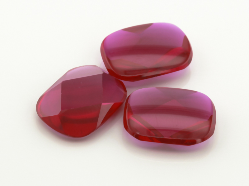 Synthetic/Lab Grown Ruby 16x12mm Cushion Buff Top Faceted Back Bright Red