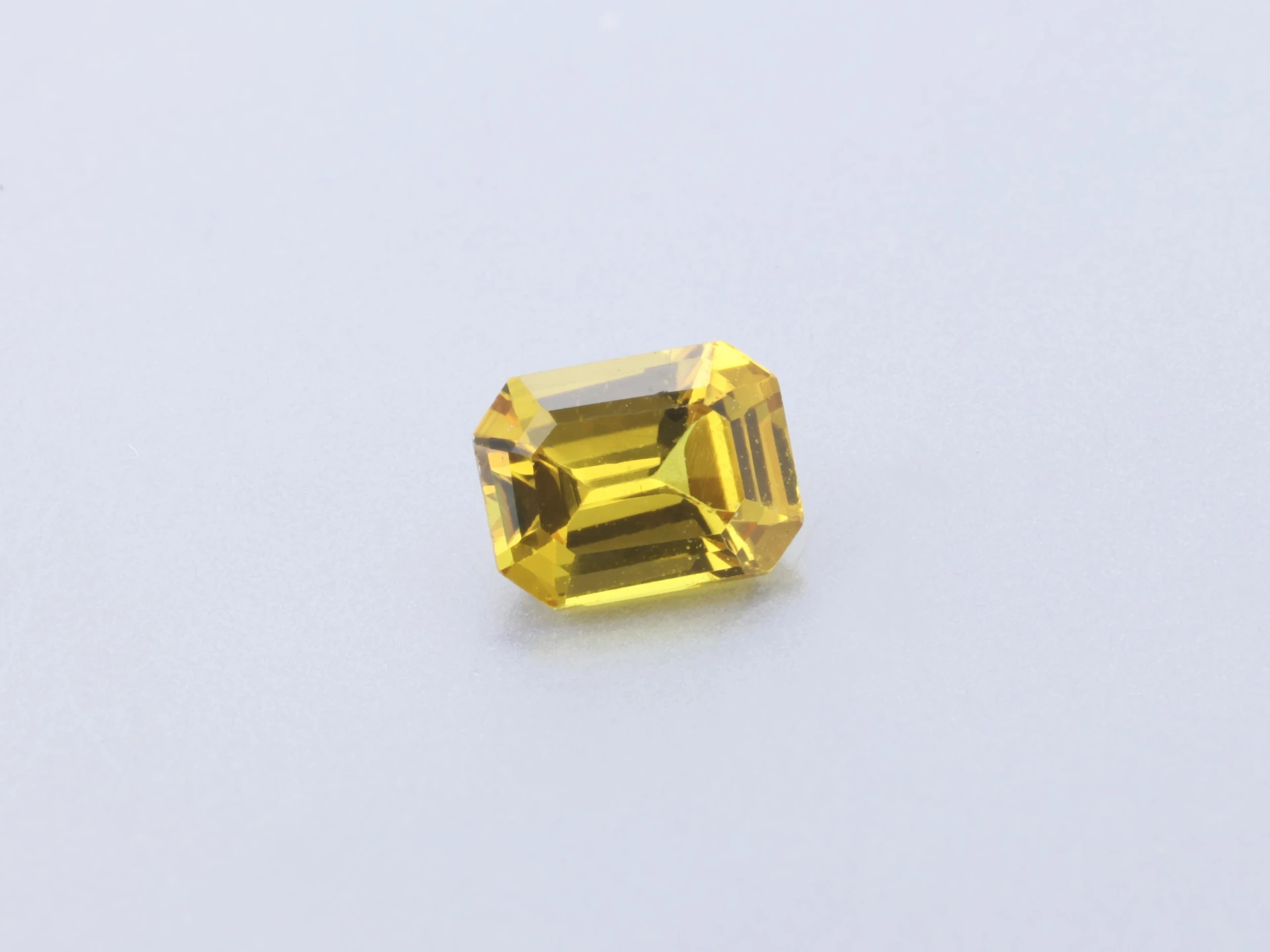 Beryllium Treated Sapphire 4x3mm Emerald Cut Mid to Dark Yellow