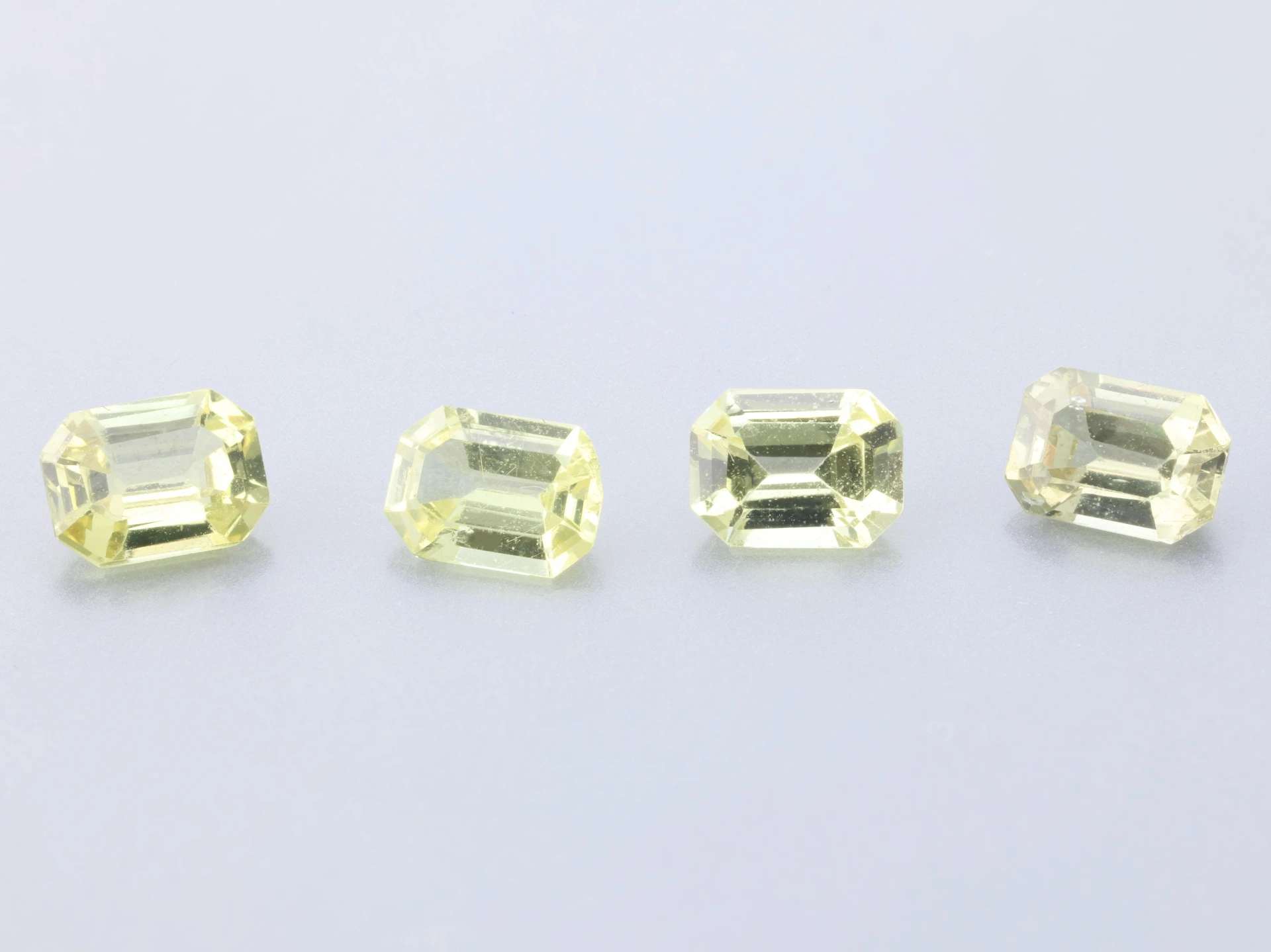 Beryllium Treated Sapphire 4x3mm Emerald Cut Light to Mid Yellow