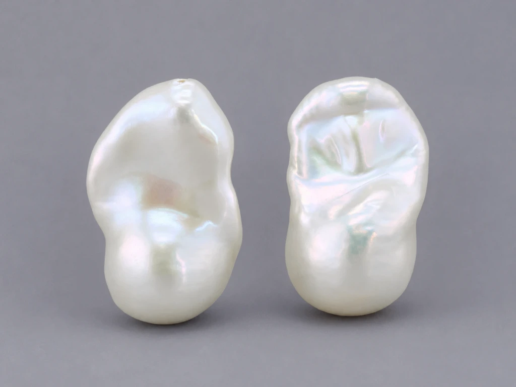 [JFUZ2015X10] Freshwater Pearl Baroque
20x14mm+/- Free Form Half
Drilled White PAIR