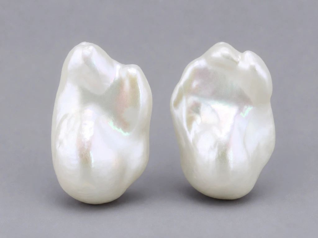 [JFUZ2518X1] Freshwater Pearl Baroque
25x18mm+/- Free Form Half
Drilled White PAIR