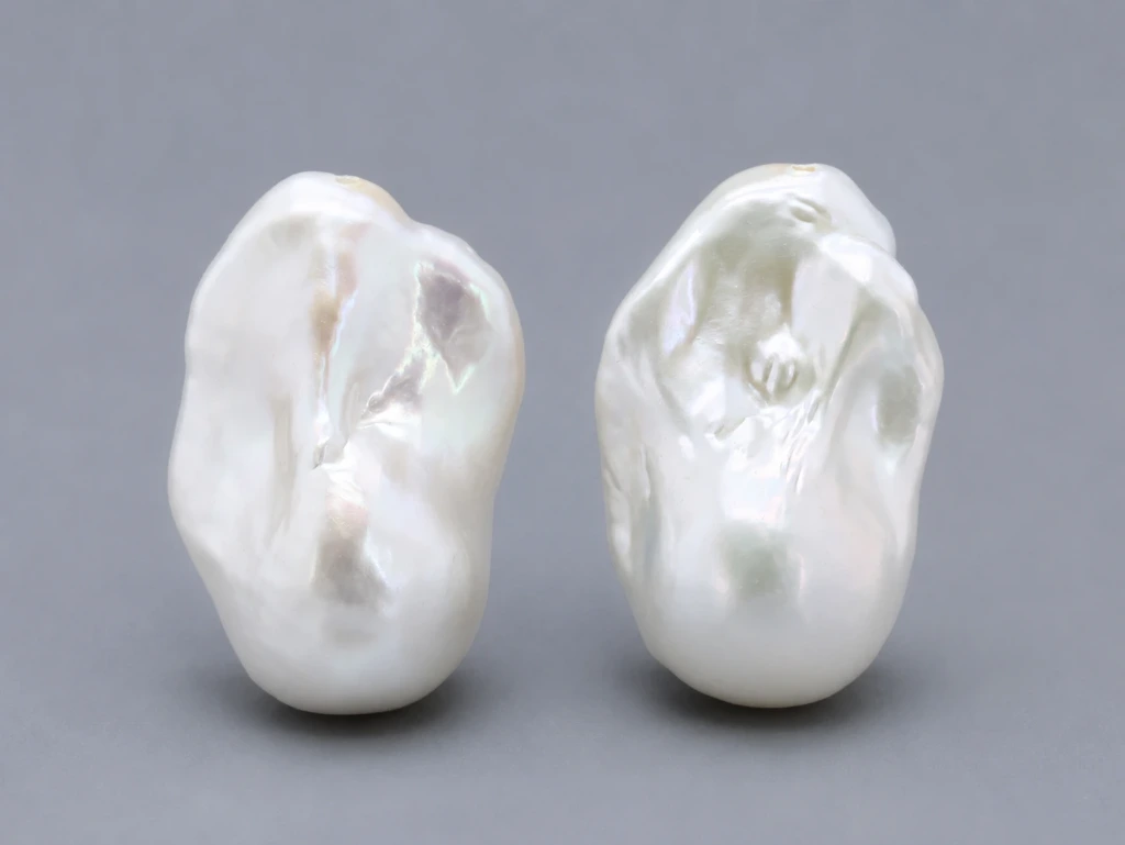 [JFUZ2518X15] Freshwater Pearl Baroque
25x18mm+/- Free Form Half
Drilled White PAIR