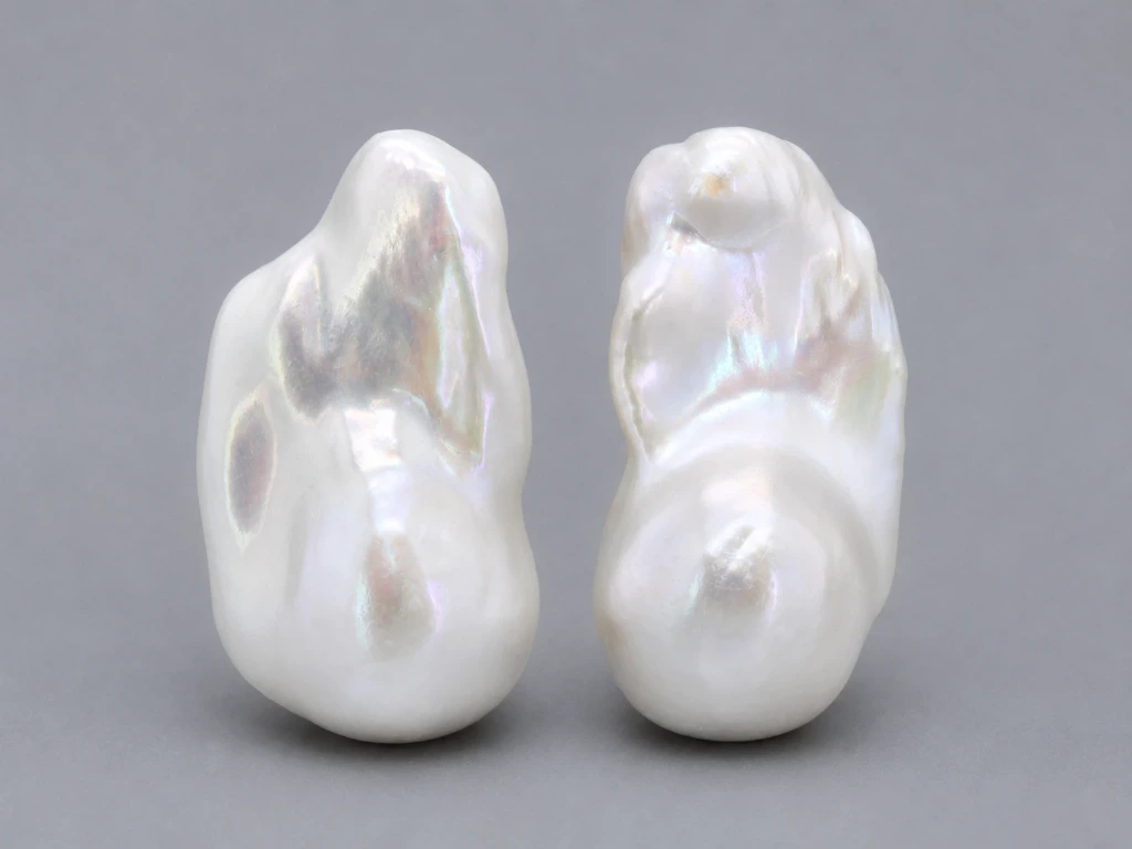 [JFUZ2518X16] Freshwater Pearl Baroque
25x18mm+/- Free Form Half
Drilled White PAIR