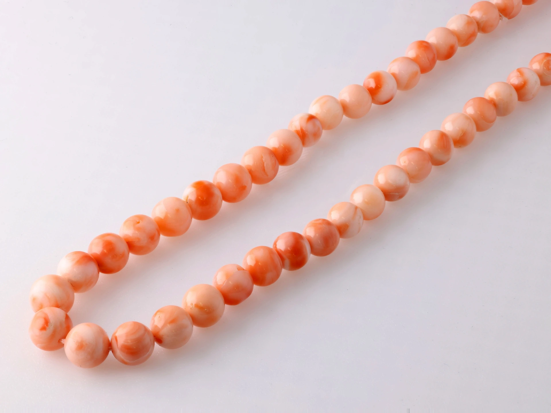 Coral 6.5-9mm Graduated Round Polished Strand Pink